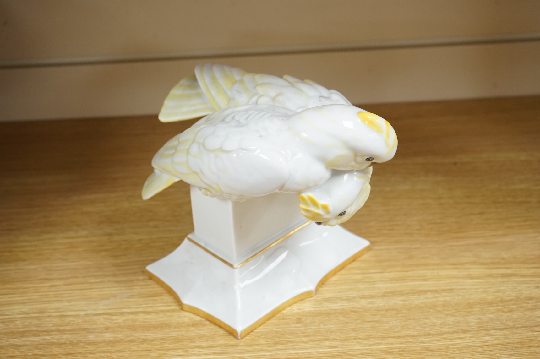 A Lorenz Hutschenreuther porcelain figure group of two cockatoos, stamped to the base, 19cm high